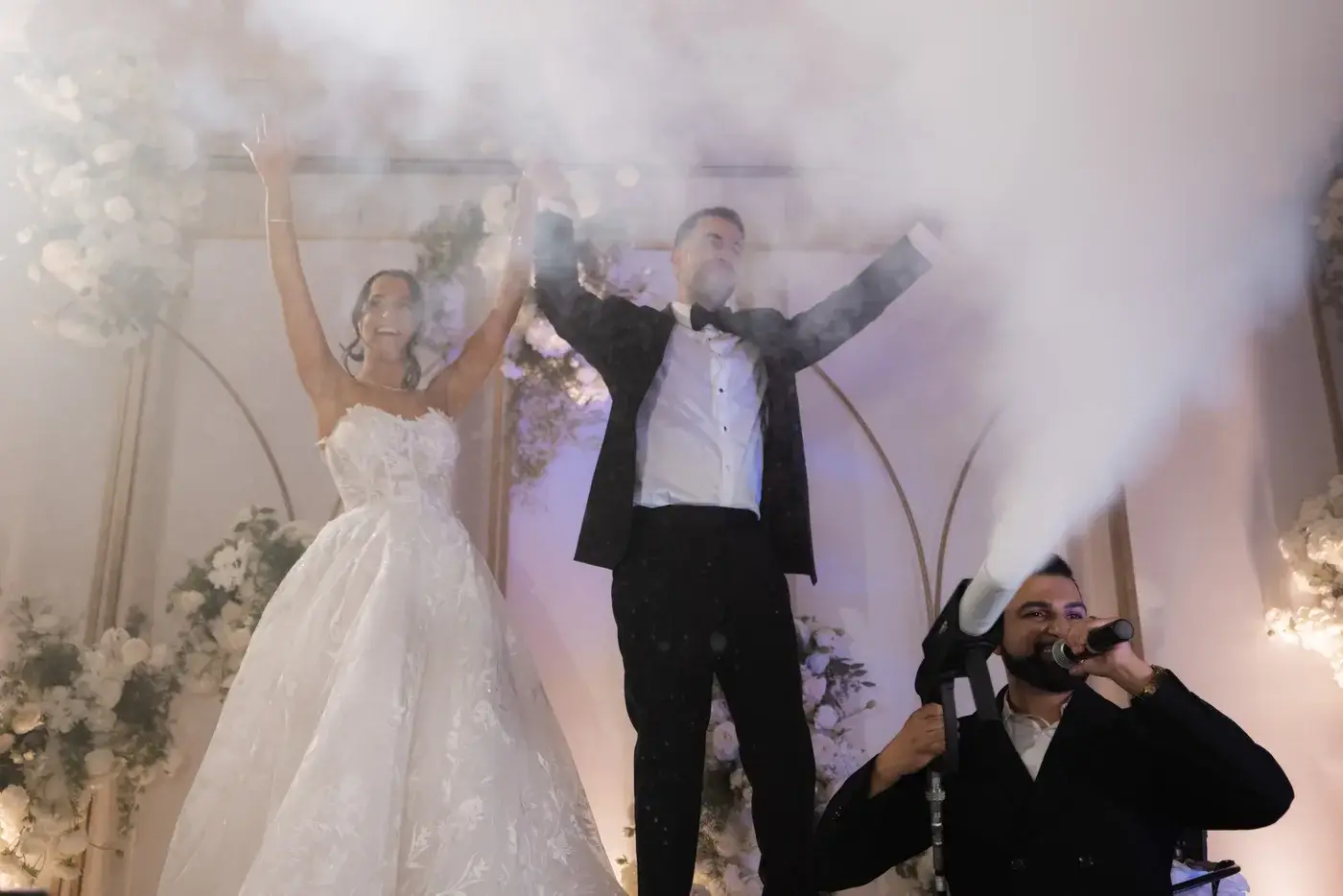 DJ Next Level firing a CO2 jet on stage as the couple celebrates at the Four Seasons Hotel Westlake Village